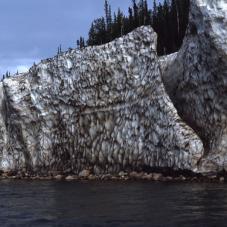 In winter, at a specific location, the Great Bear River (Sahtú De) freezes to the bottom while ice continues to form on the surface. At the end of the winter, the ice was as thick as in this picture. Note the date: June 30, 1968.