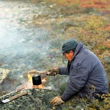 In the treeless barren land, Pierre Catholique manages to boil water for a cup of tea.